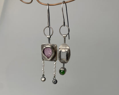 Handcrafted dangle earrings featuring rose tourmaline, quartz, jade and pearl accents.